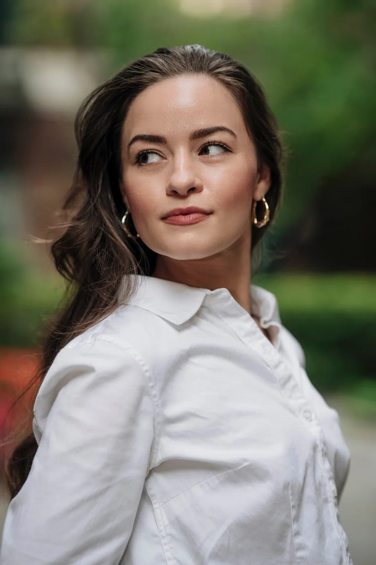 Athena Sternklar in a white shirt standing in soft natural light, reflecting the elegant, faith-rooted tone of Preparing His Bride coaching